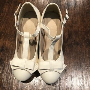 White t strap pumps with bow